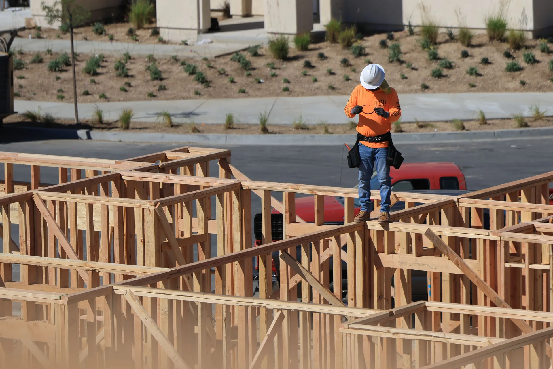 Construction worker on a framed house