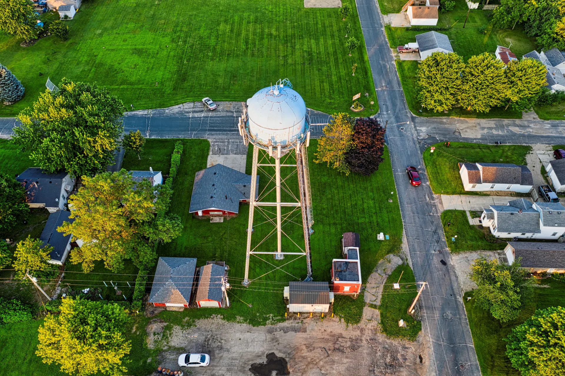 Water tower over a small-town neighborhood