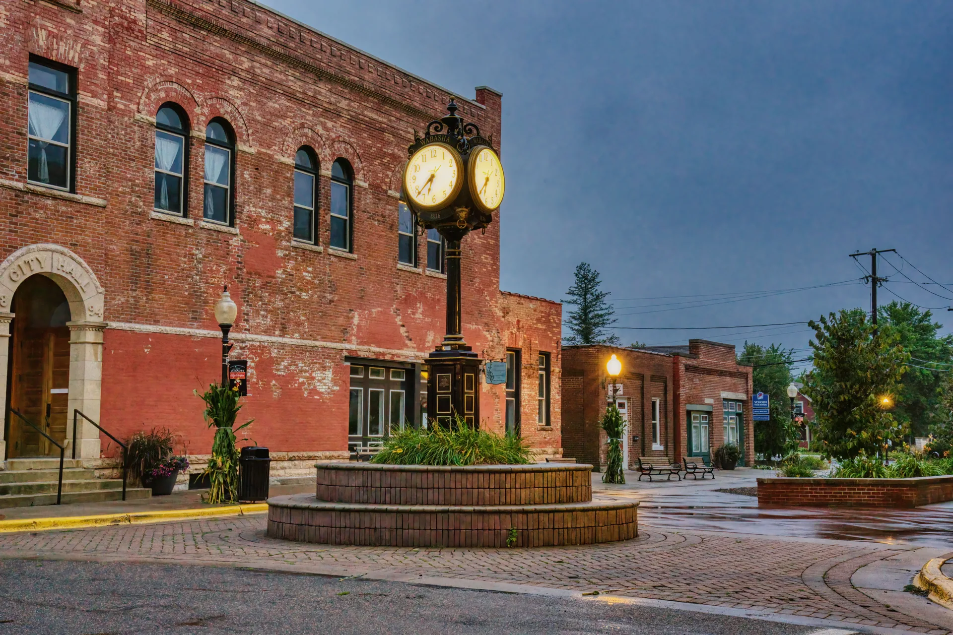 Brick building and street clock in a small downtown