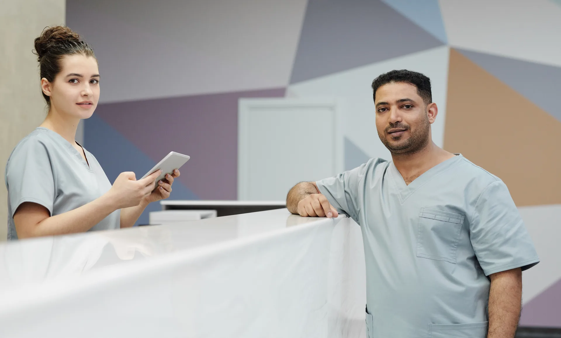 Medical staff at a clinic front desk