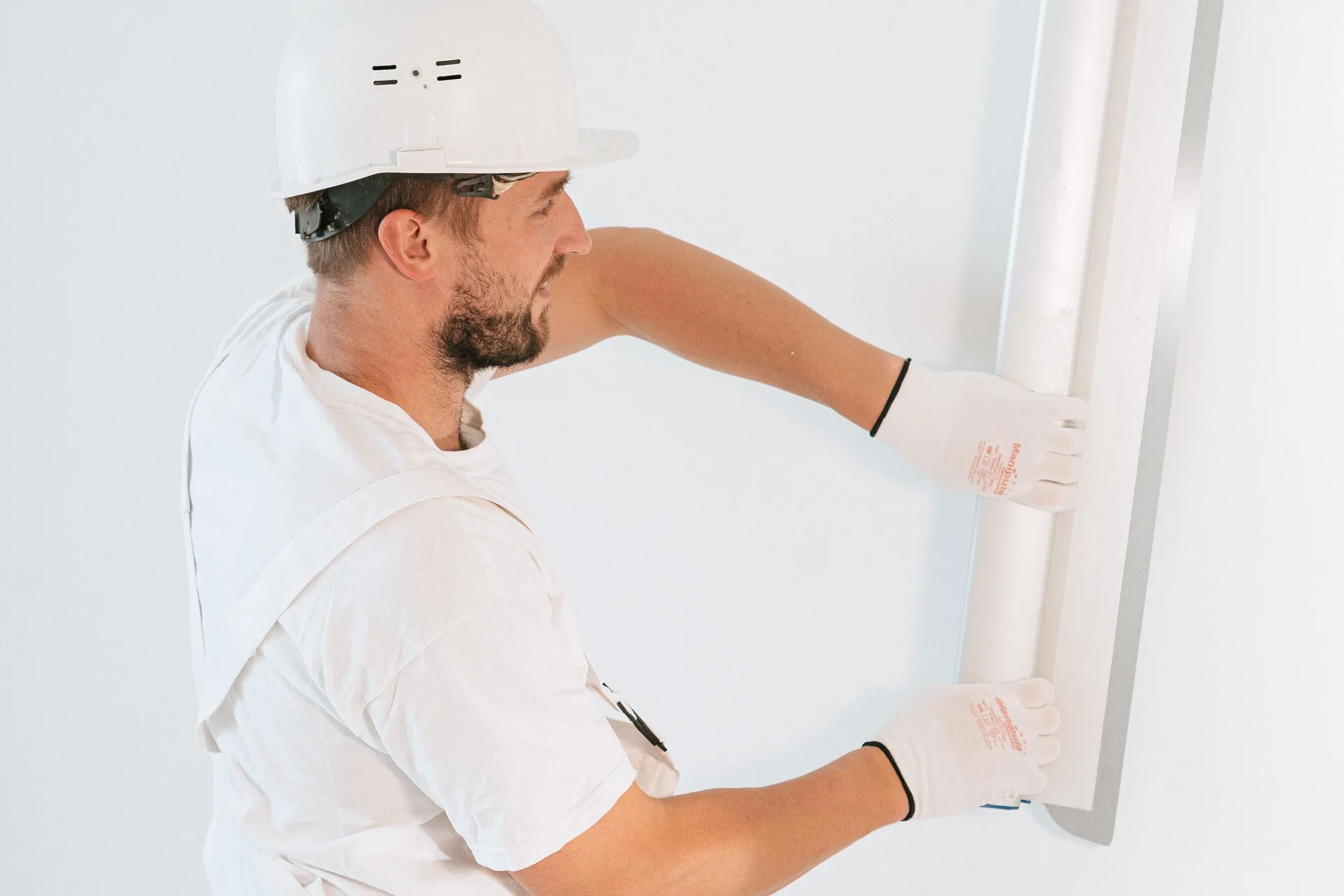 Installer fitting a new window