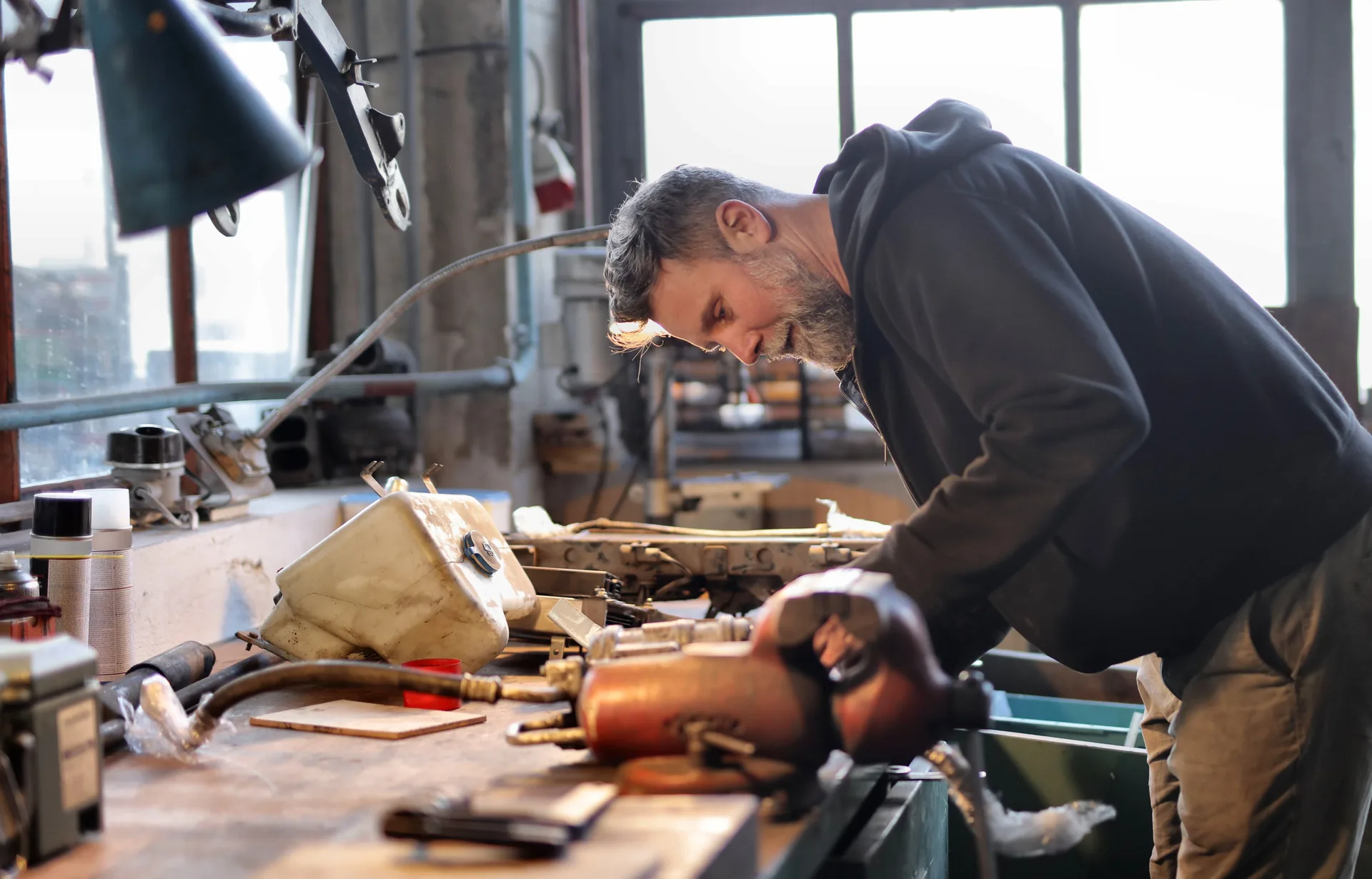 Workshop owner at the workbench
